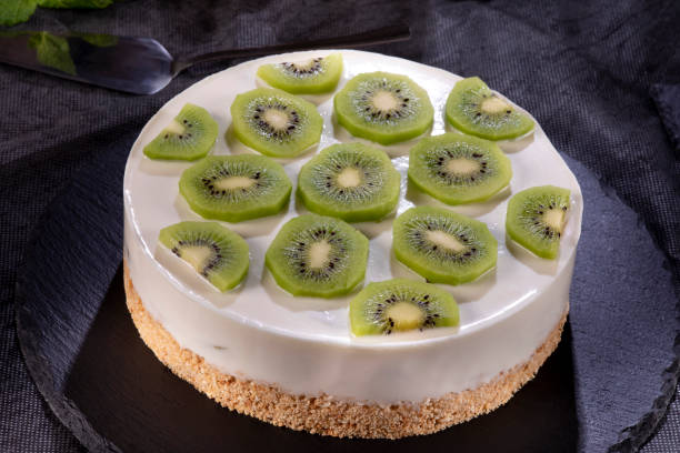 istock Decorated cheesecake with kiwi 1296373056