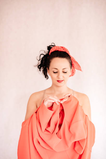 istock Lady in red dress isolated on white background. 1296374460