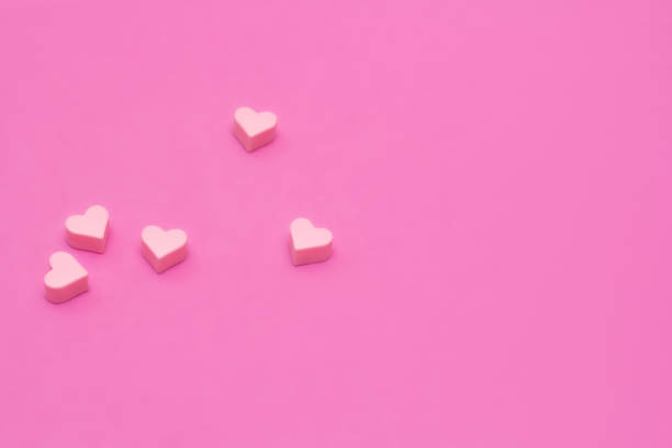 istock Pink hearts on background with copy space. Place for text 1296374646