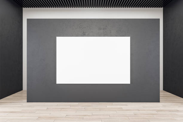 istock Modern exhibition interior with blank banner on concrete wall. 1296375624