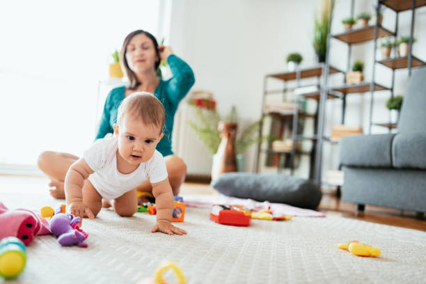 istock Curious baby girl at home, first steps and playing 1296377051