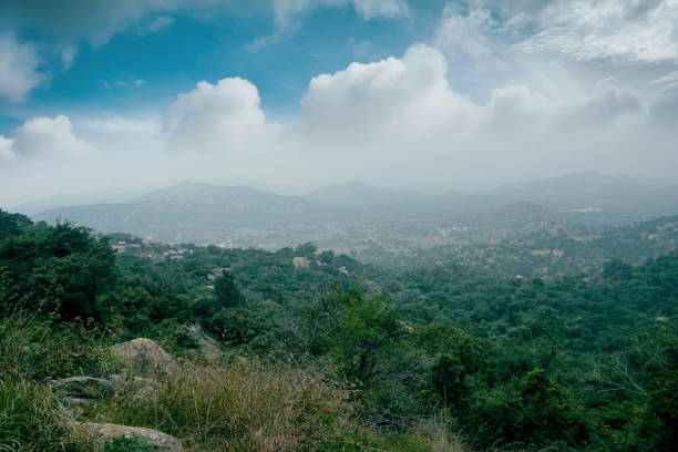 istock Green valley and mountain range with moody sky 1296379682