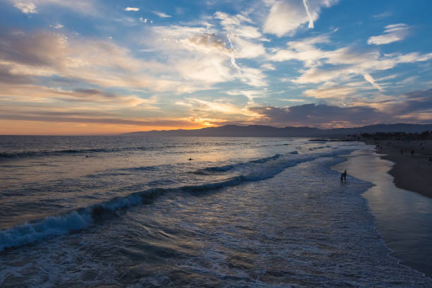 istock sunset over Pacific Ocean at Venice Beach, California 1296382895