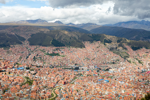 City town center of La Paz with lots of living houses scattered on the hills, Bolivia.