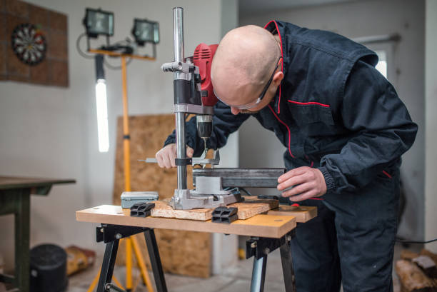 istock Metal worker drilling metal pipe in workshop 1296384944