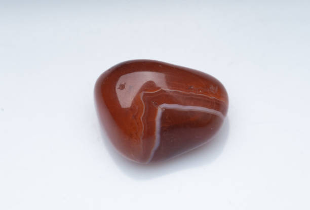 istock Natural stone carnelian on a white background 1296385841
