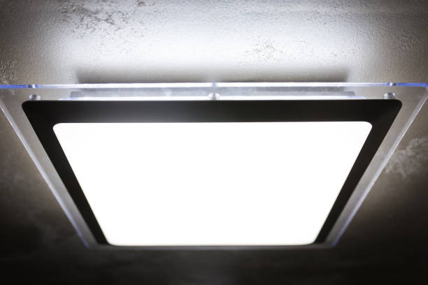 istock Led lamps built into the ceiling glowing in the dark 1296387440