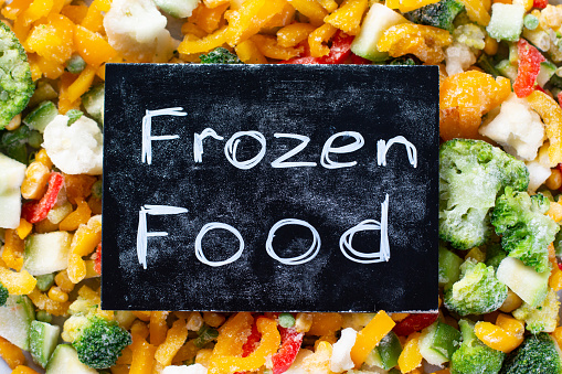 Multi-colored frozen vegetables, summer vitamin set. Healthy food in winter. Frozen food