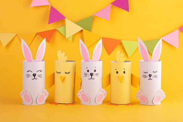 istock cute easter bunnies and paper birds with handmade Easter eggs. background for the Easter holiday 1296389316