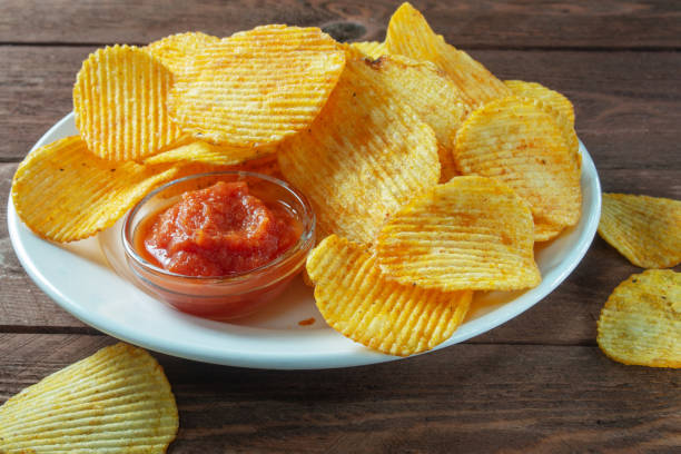 istock spicy potato chips with tomato sauce 1296389569