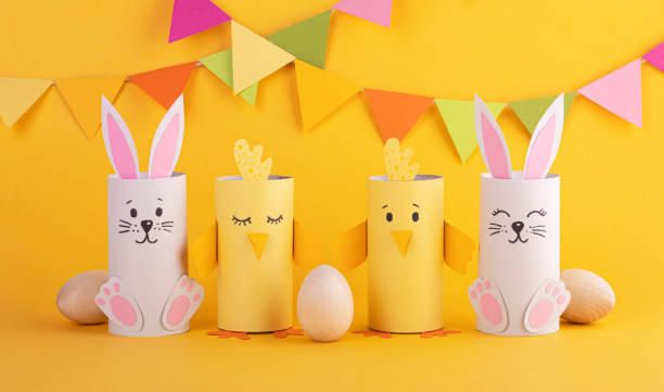istock cute easter bunnies and paper birds with handmade Easter eggs. background for the Easter holiday 1296390309