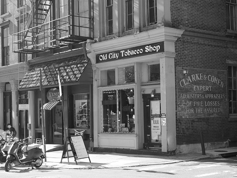 Philadelphia, USA - June 11, 2019: Monochrome image of the old buildings that can be found in the old city neighborhood of Philadelphia. This image was taken at the corner of Chestnut St with Bank St.