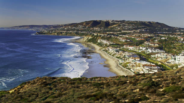 Drone Shot of Waves Crashing on the Beach in Dana Point Drone shot of Dana Point in Orange County, California. dana point stock pictures, royalty-free photos & images