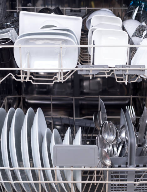 istock dishes in dish washer machine at the kitchen 1296392551