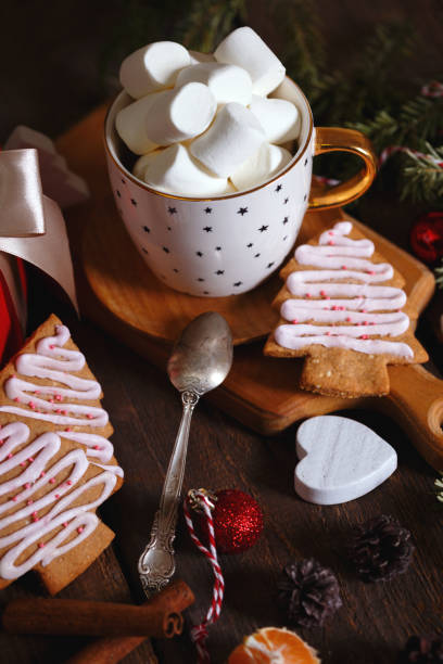 istock cup of coffee and marshmallows. Presents, gingerbread and Christmas decorations
