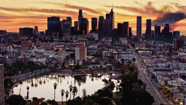 Aerial shot of Los Angeles from over MacArthur Park at sunrise.