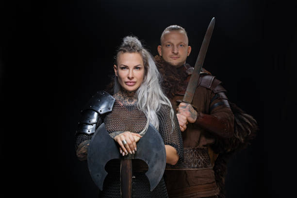 istock Weapon wielding viking warrior couple in studio shot 1296395103