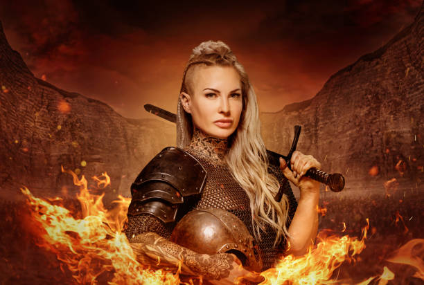 istock Weapon wielding viking inspired warrior female in a fantasy fire setting 1296395121