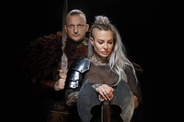 istock Weapon wielding viking warrior couple in studio shot 1296395164