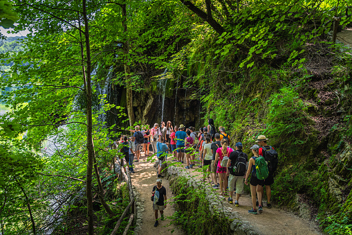 Plitvicka Jezera, Croatia, July 2019 Tourists taking pictures and making selfies at waterfalls in Plitvice Lakes National Park UNESCO World Heritage