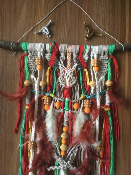 istock Handmade Native American wall hanging white color with feathers 1296400811