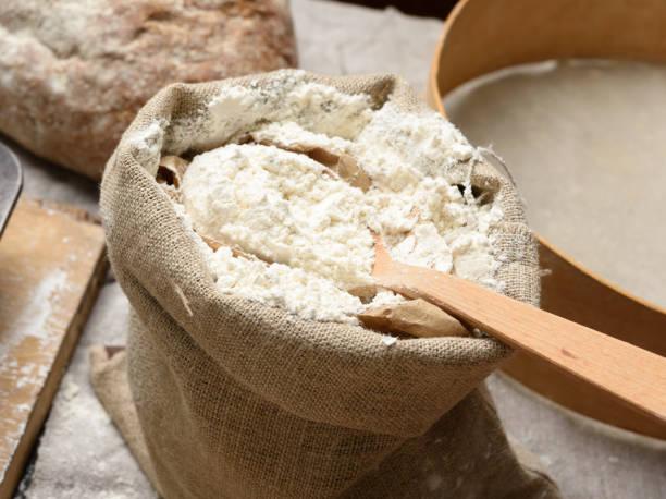istock white wheat flour in a small burlap sack 1296401568