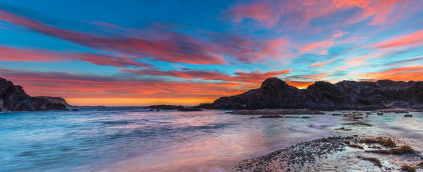 istock Colourful High Cloud Sunrise Seascape Panorama and Rock Formations 1296402892