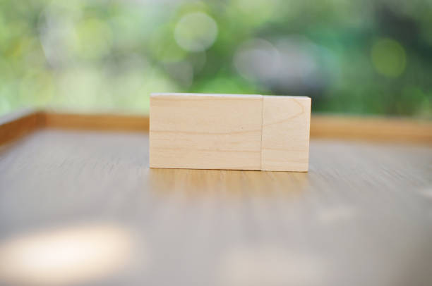 istock Wooden Flash Drive with a natural, unfocused background 1296403615