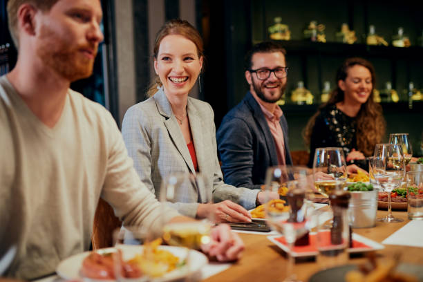istock Couple sitting in restaurant, eating diner and drinking wine. 1296405456