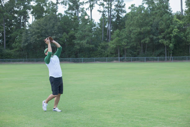 istock Baseball season is here.  Outfielder practicing. 1296406386