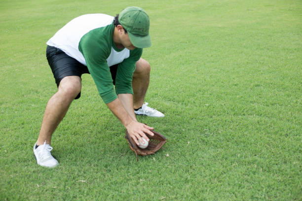 istock Baseball season is here.  Outfielder practicing. 1296406460
