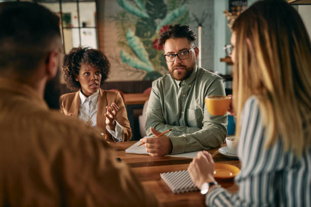 istock Discussing business at the local cafe 1296407403