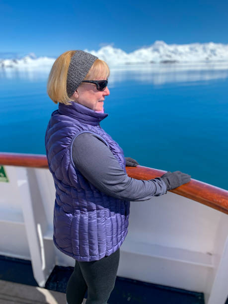 istock Single woman exploring the Antarctic peninsula 1296407436