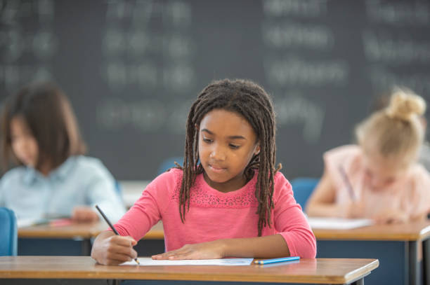 istock African American girl in elementary classroom 1296409439