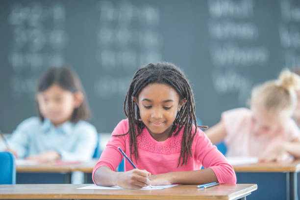 istock African American girl in elementary classroom 1296409440