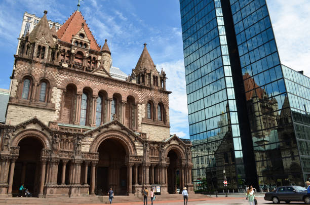 trinity church and reflection in john hancock tower in boston - boston church famous place john hancock tower imagens e fotografias de stock