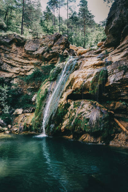 istock landscape with a pool with waterfall in a place of spain 1296415250