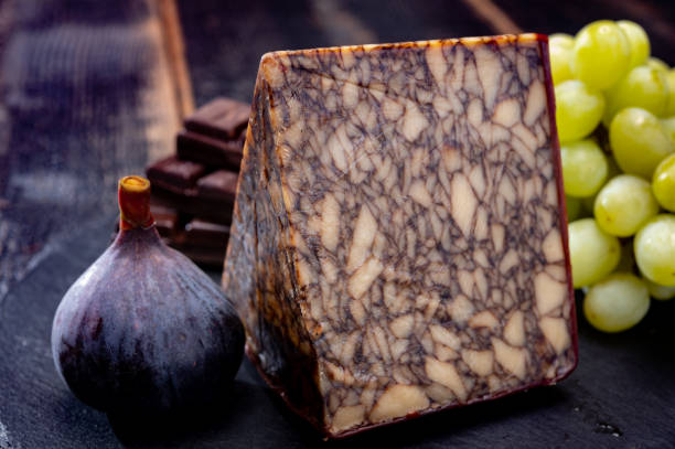istock Cheese collection, Irish brown waxed marbeled cheddar cheese flavoured with Guinness dark stout beer 1296415418