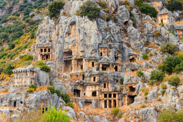 Rock-cut tombs of Lycian necropolis of the ancient city of Myra in Demre, Antalya province in Turkey stock photo
