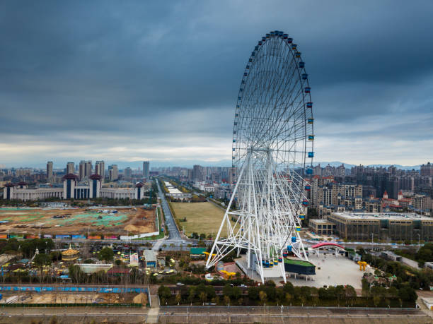 istock An empty road under the ferris wheel in a city park 1296415876