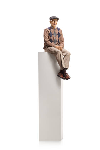 istock Male pensioner sitting on a column 1296416774