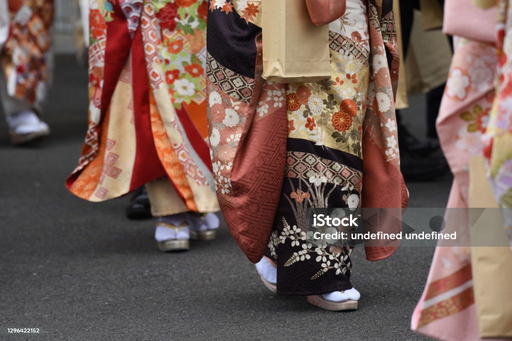 Young Japanese women wearing traditional Kimono for the coming of age day celebration. Geta Sandal Stock Photo