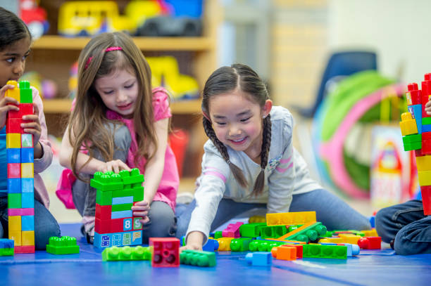 istock Teamwork to build the tallest tower 1296423233