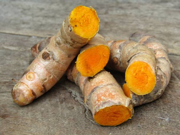 istock turmeric root on wooden background 1296423951