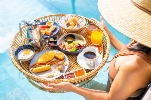 istock luxury floating breakfast eat in swimming pool 1296424004