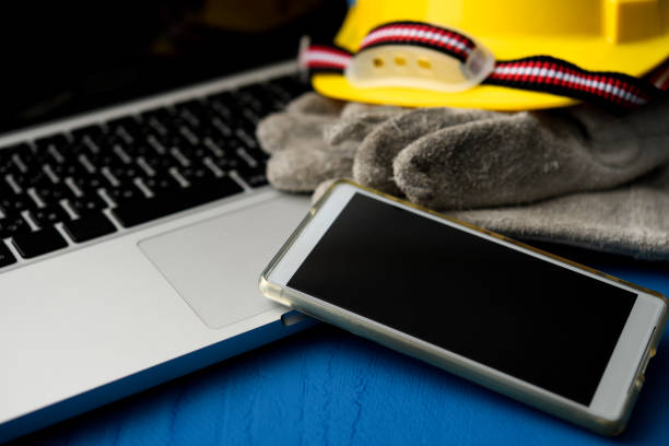 istock Laptop with work tools with shallow depth of field 1296425605