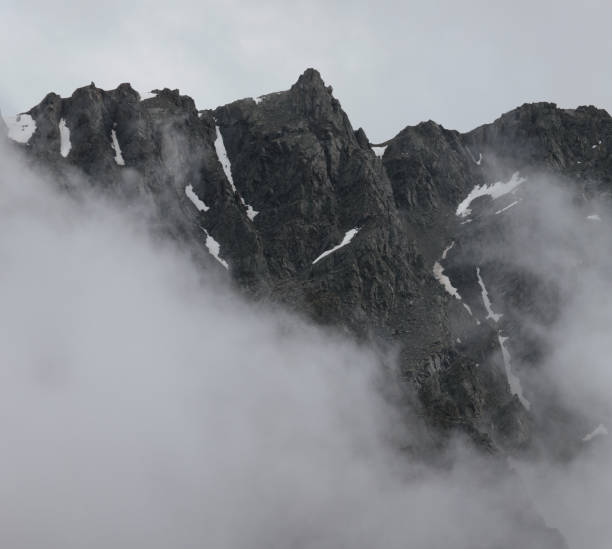 istock Rocky slopes in the clouds 1296430586