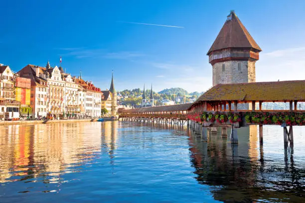 Luzern wooden Chapel Bridge and tower panoramic view, landmark in town in central Switzerland