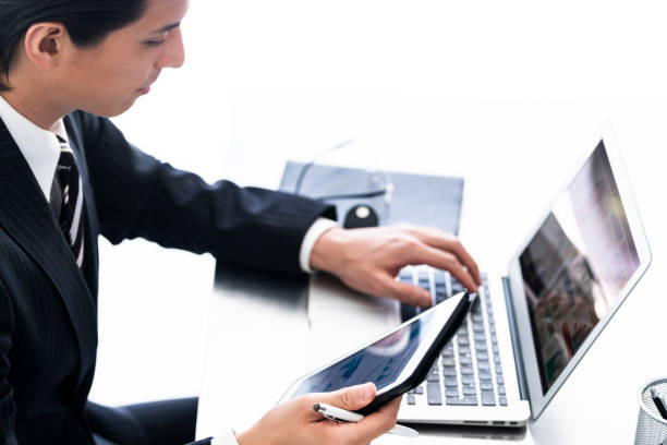 a businessman wearing suits are working at his office - thirty pieces of silver imagens e fotografias de stock