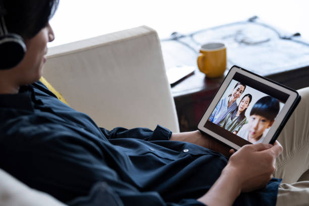 istock A man having a fun video chat at home 1296434001
